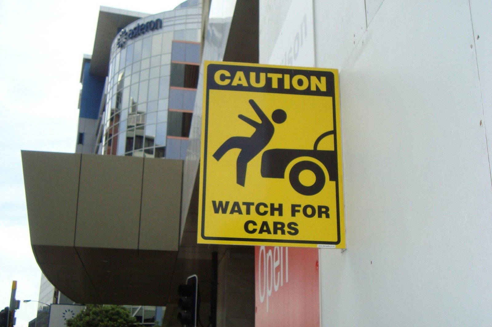 Crowded convention hall showing potential hazards like cables and spills